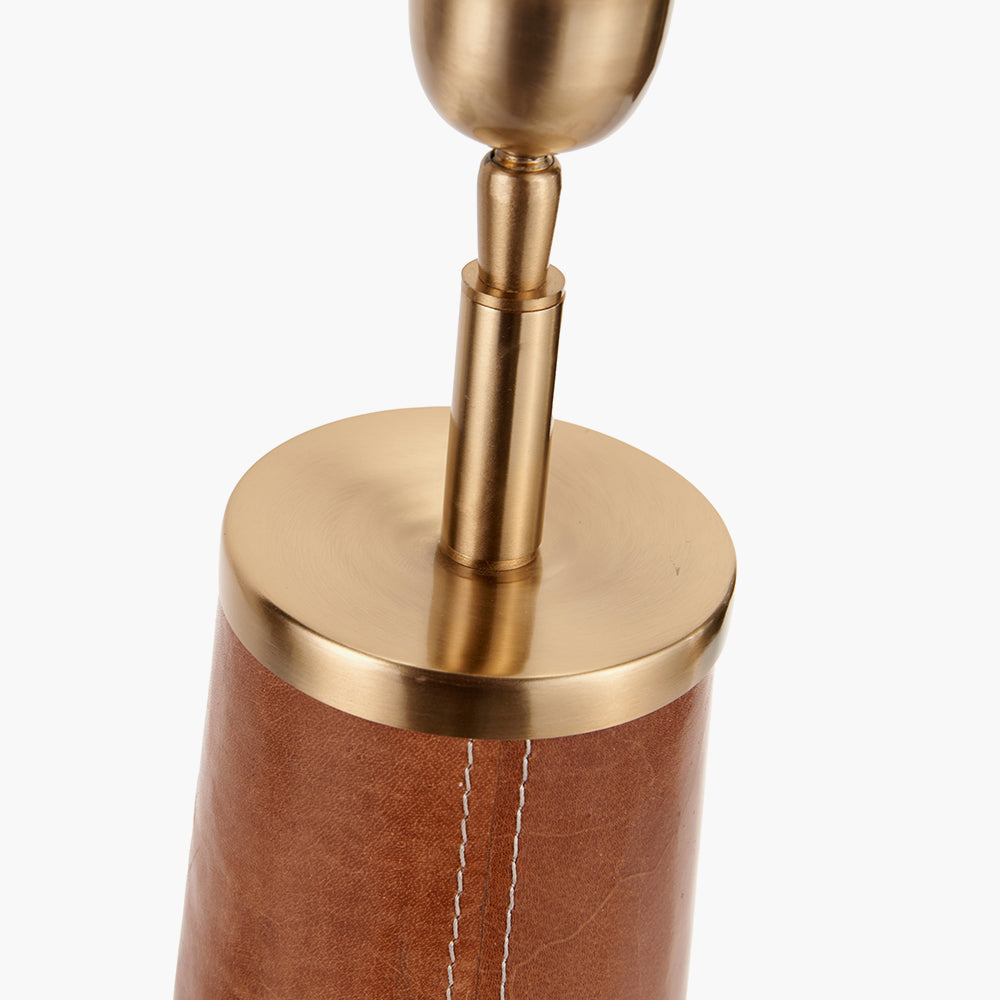 Brown leather base with brass accents and visible stitching.