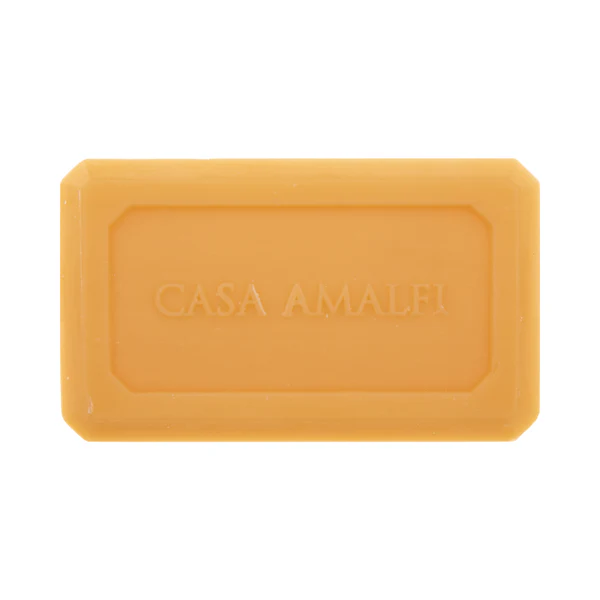 Yellow bar of soap with 'Casa Amalfi' branding on a white background