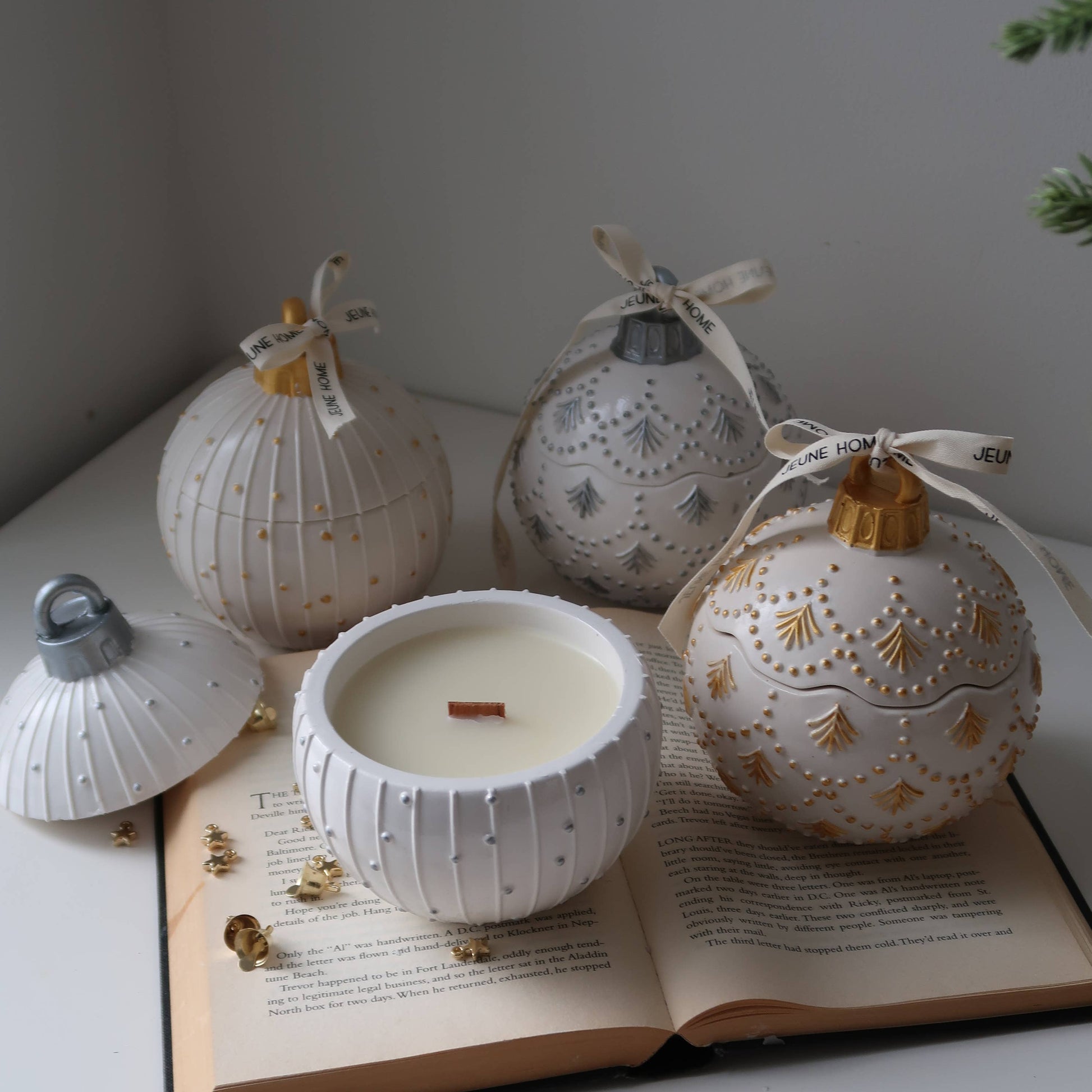 Decorative white lanterns with gold accents on an open book