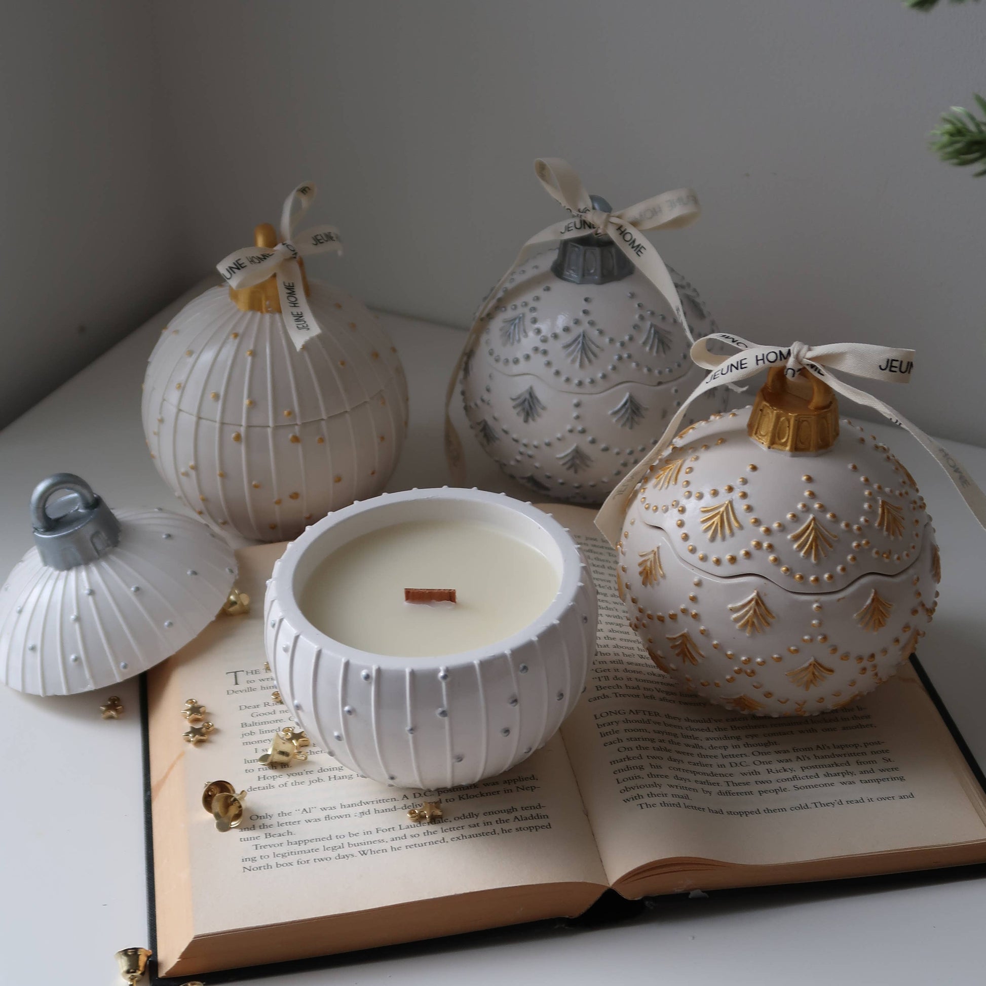 Decorative white lanterns with gold accents on an open book