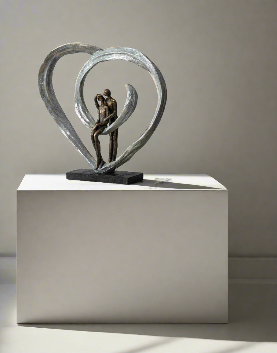 Love Sculpture in Circular Heart – Bronze | Woodcock and Cavendish