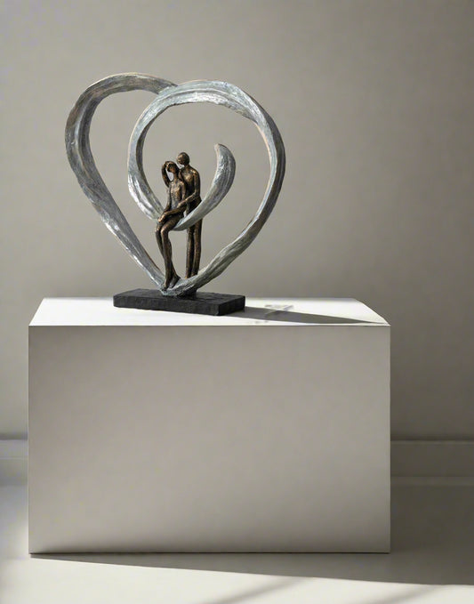 Love Sculpture in Circular Heart – Bronze | Woodcock and Cavendish