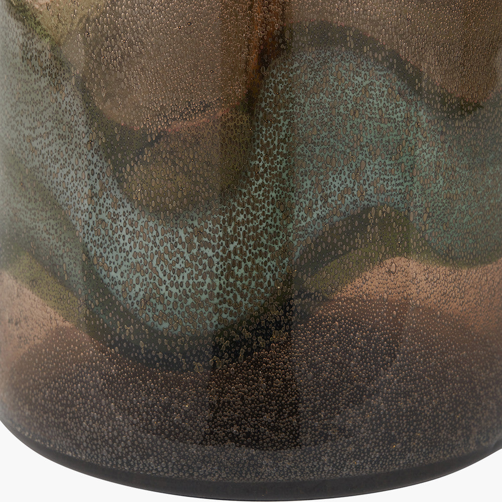 Close-up of a textured ceramic vase with a speckled pattern.