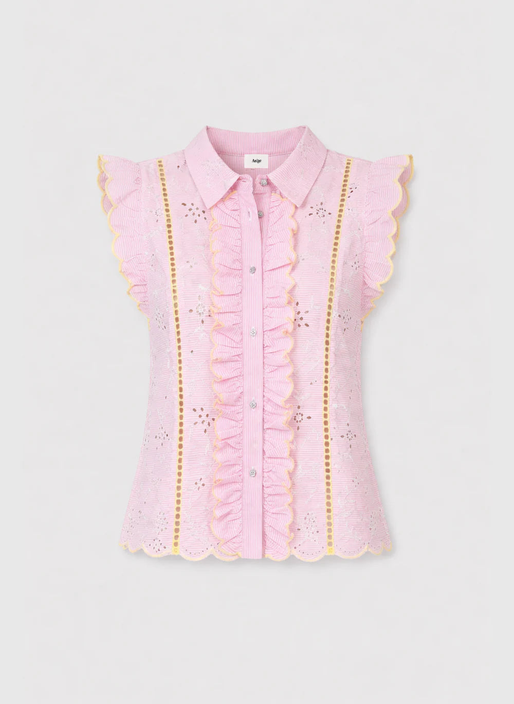 Pink blouse with ruffled details on a light gray background