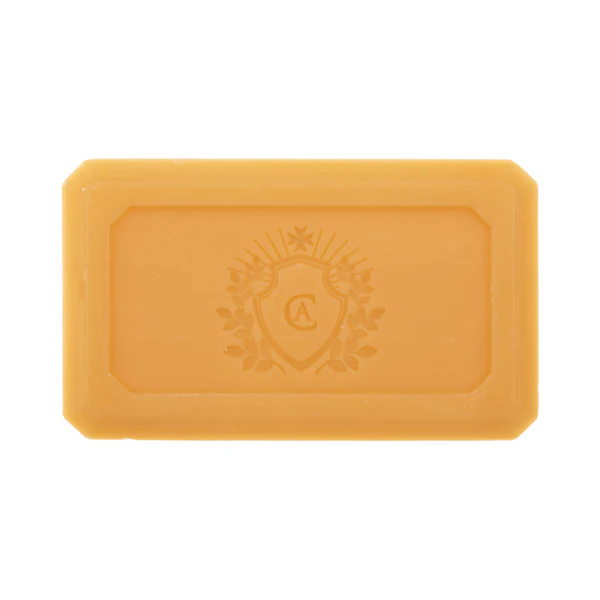 Yellow soap bar with a logo on a white background