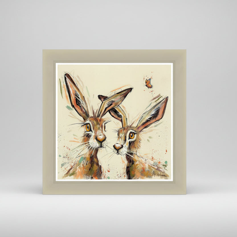 Framed artwork of two hares with a butterfly on a light gray background
