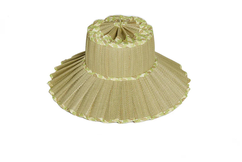 Beige straw hat with ruffled brim on a white background