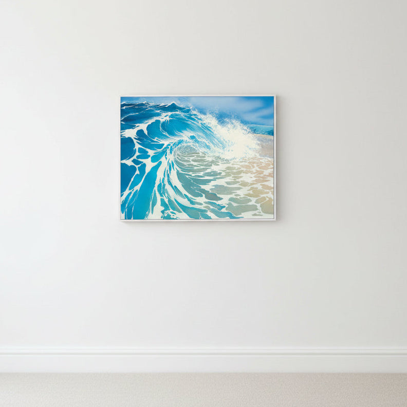 Canvas print of a blue wave design on a white wall.