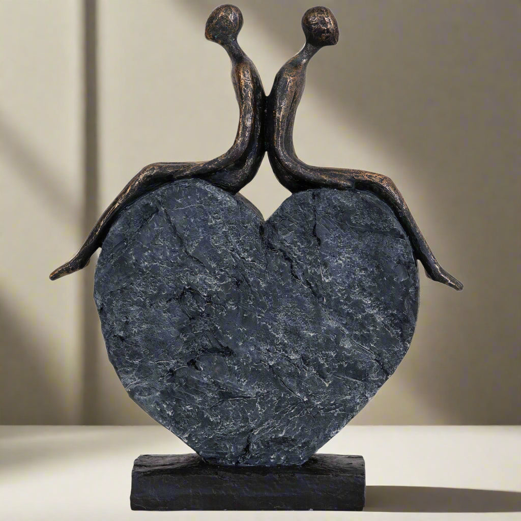 Lovers on a Heart Sculpture – A Beautiful Celebration of Love