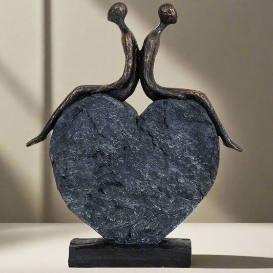 Lovers on a Heart Sculpture – A Beautiful Celebration of Love