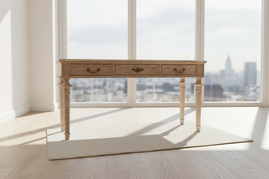 140cm natural wood console table with three drawers and a lower shelf, styled in a bright hallway.