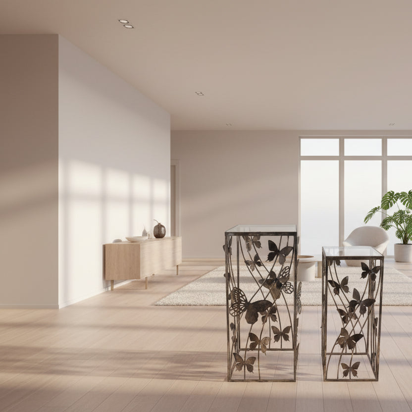 square metal side table with decorative laser-cut butterfly design on the top and sides.