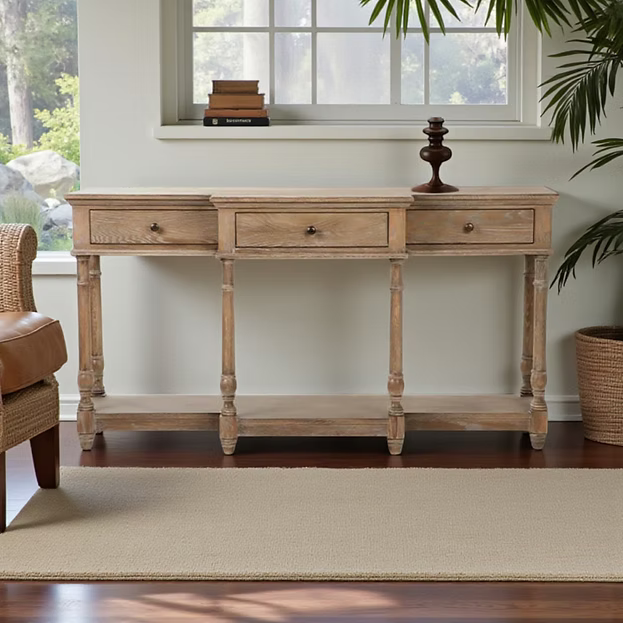 160cm wide natural wood console table with three drawers and a bottom shelf in a light, modern interior.