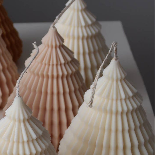Shell-shaped decorative trees on a white surface with a 'Jeune Home' card.