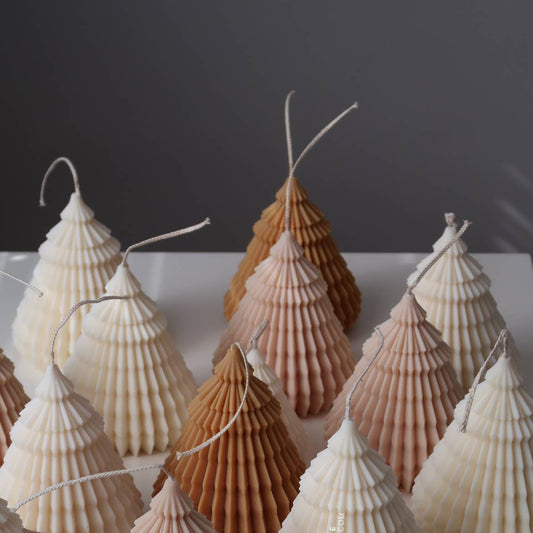 Decorative shell trees on a white surface with a dark background