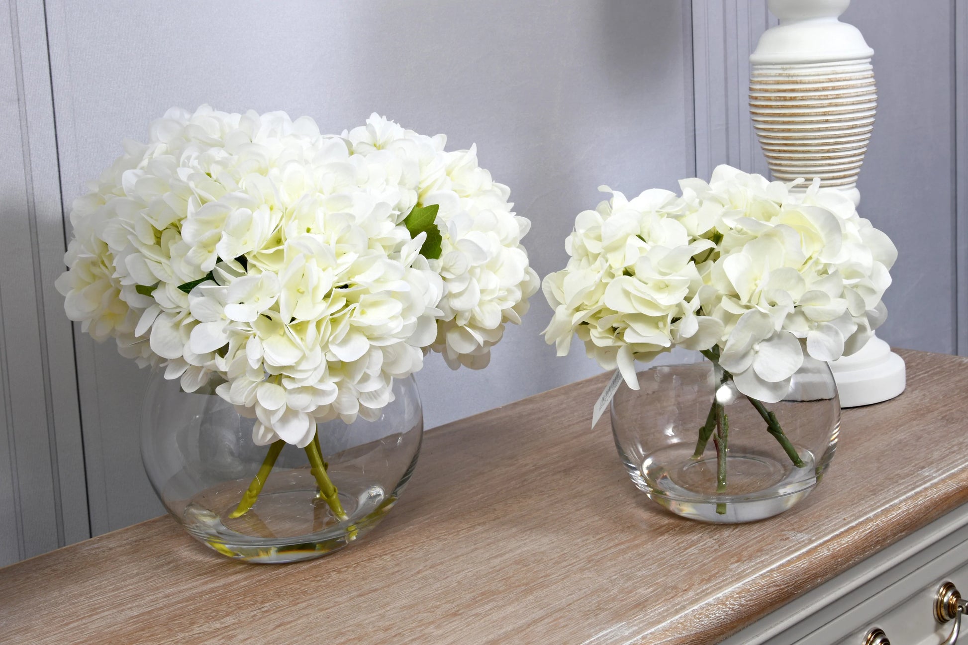 White Hydrangeas In Globe Vase for sale - Woodcock and Cavendish